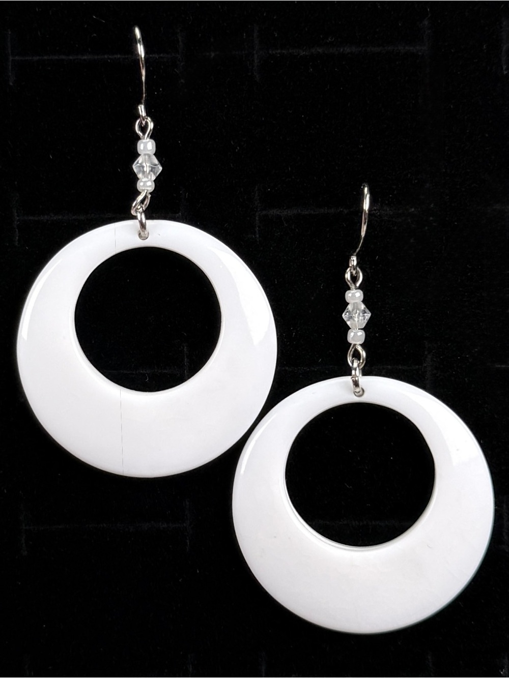 White Silvertone circular pierced earrings